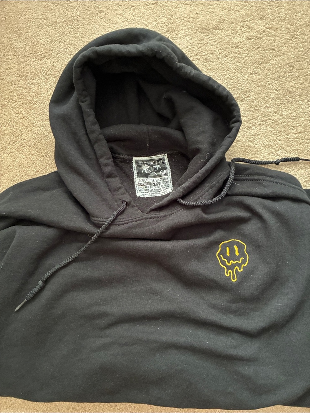 🫠 riot society Hoodie with Yellow Drip Smiley Graphic